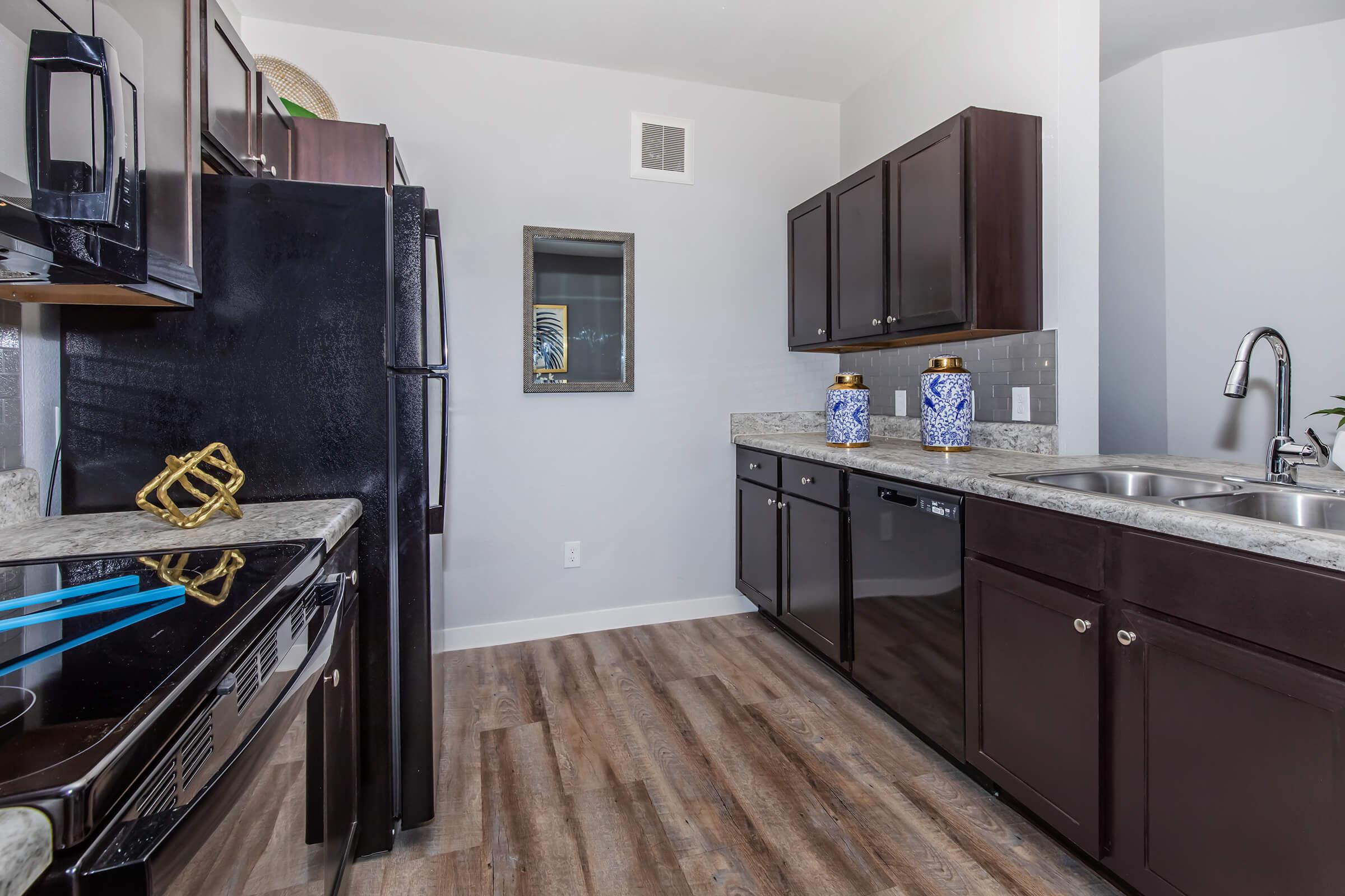 a modern kitchen with stainless steel appliances