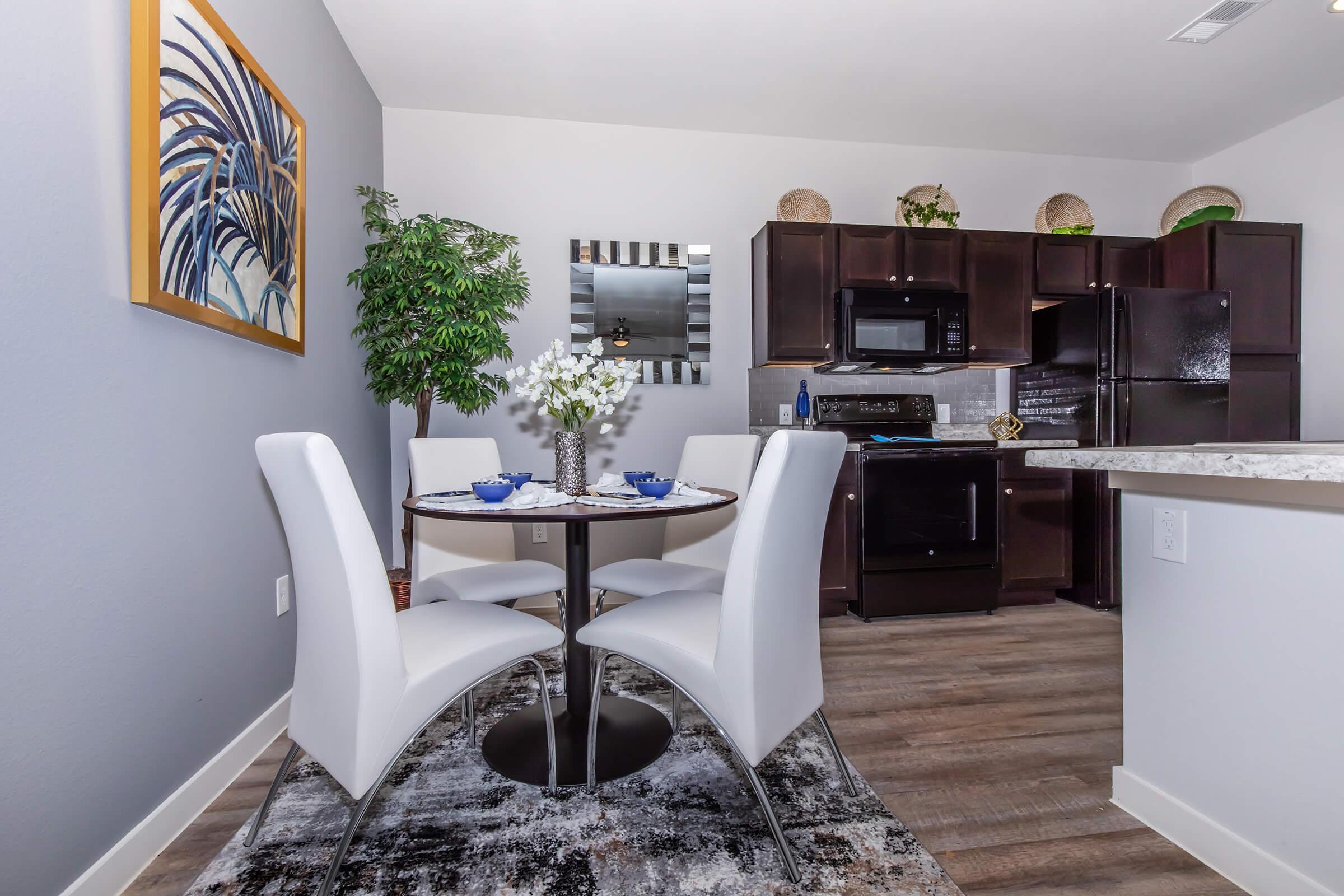 a living room filled with furniture and a mirror