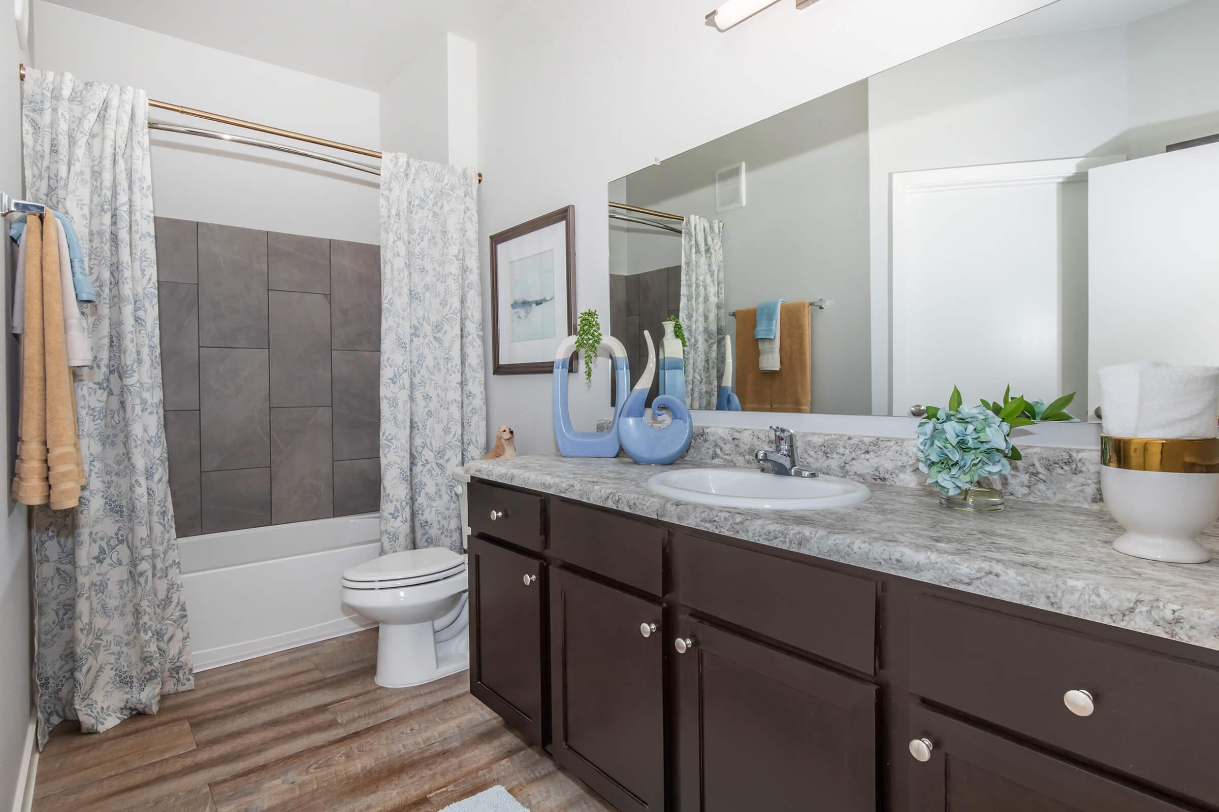 a kitchen with a sink and a mirror