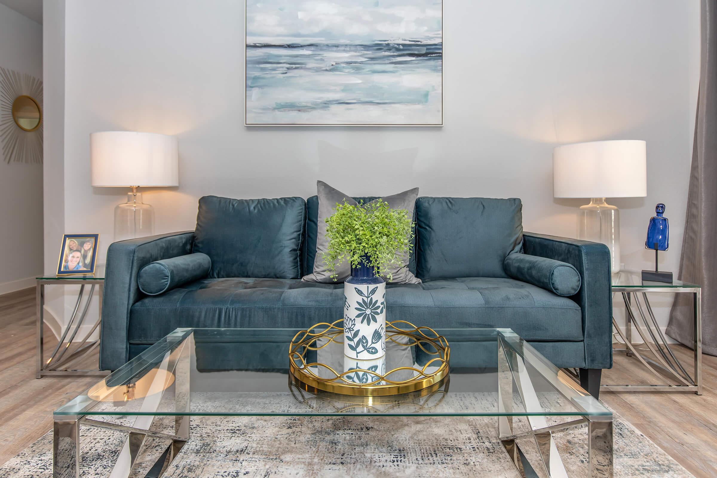 a living room filled with furniture and a fire place sitting in a chair