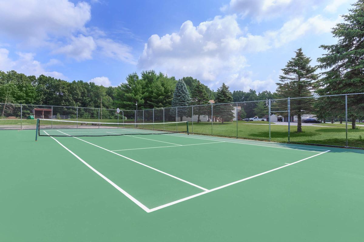 a man on a court with a racket