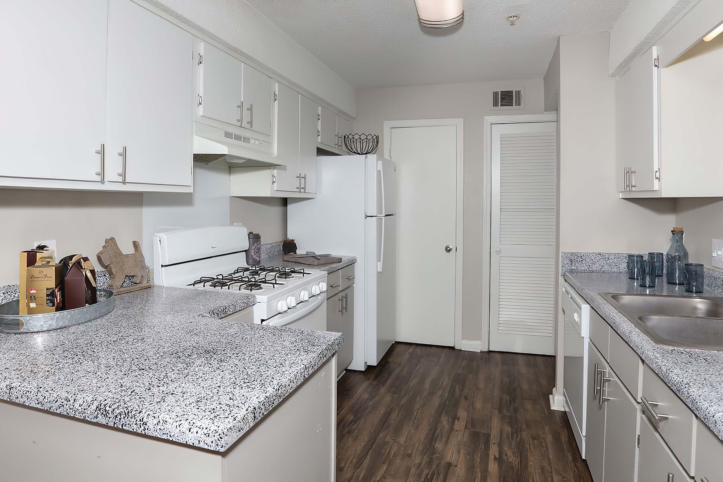 a kitchen with a stove and a sink