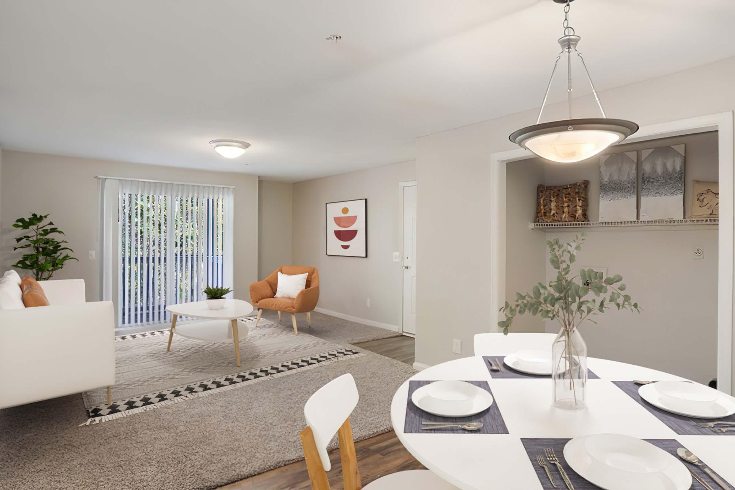 a living room filled with furniture and a table