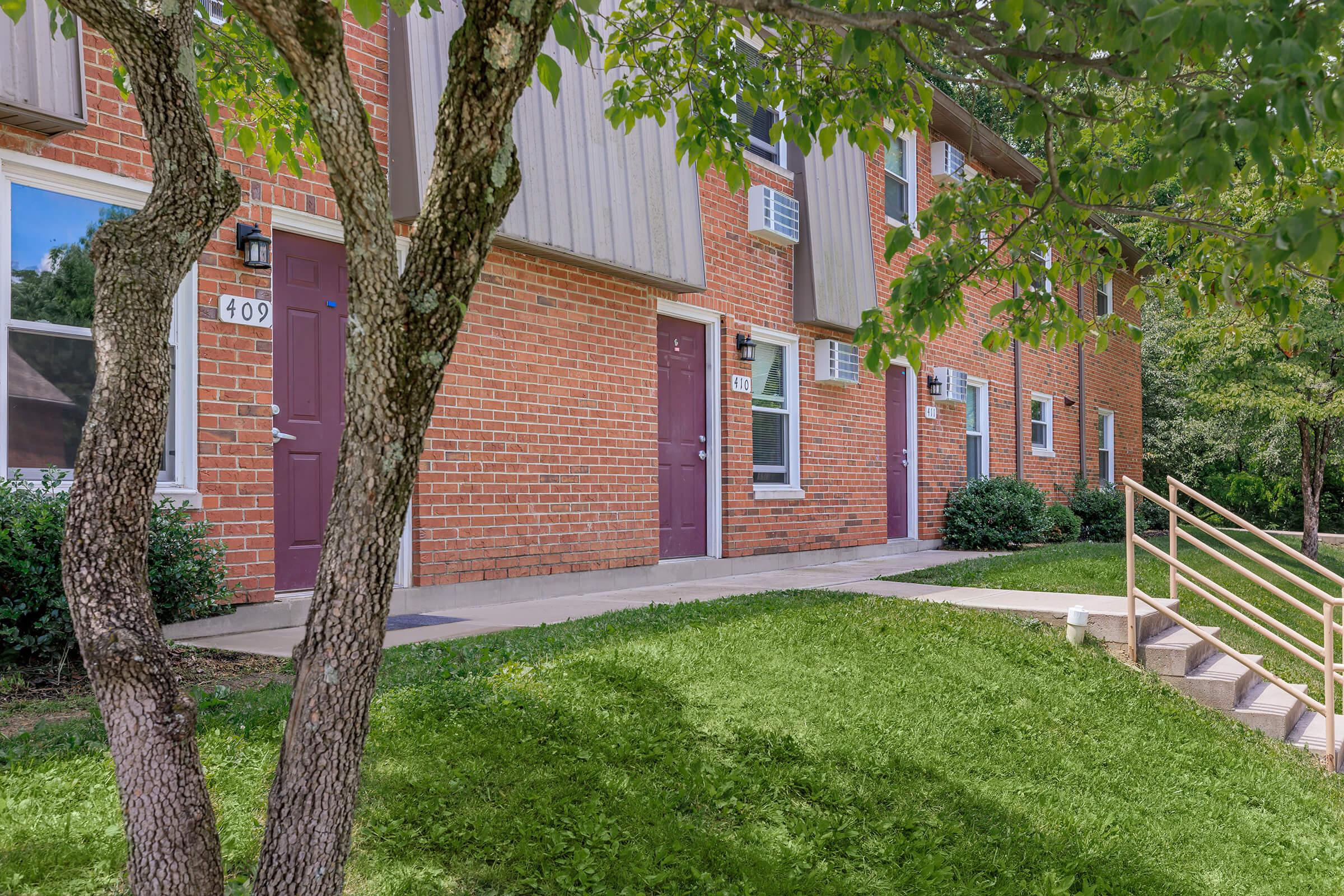 a tree in front of a house