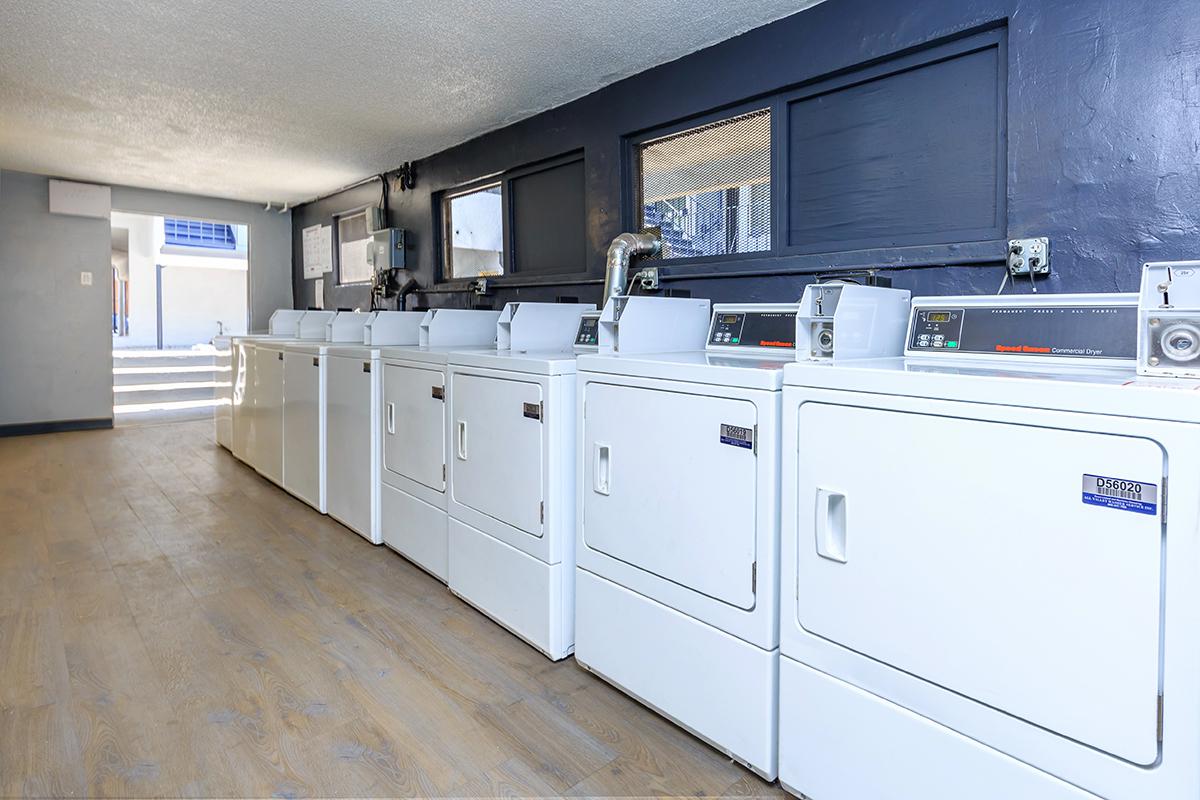 a large white refrigerator in a kitchen