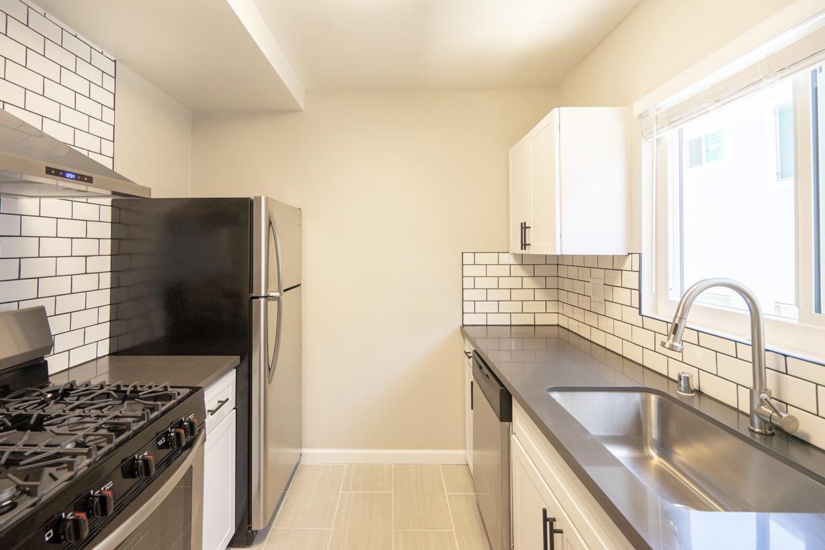 a modern kitchen with stainless steel appliances