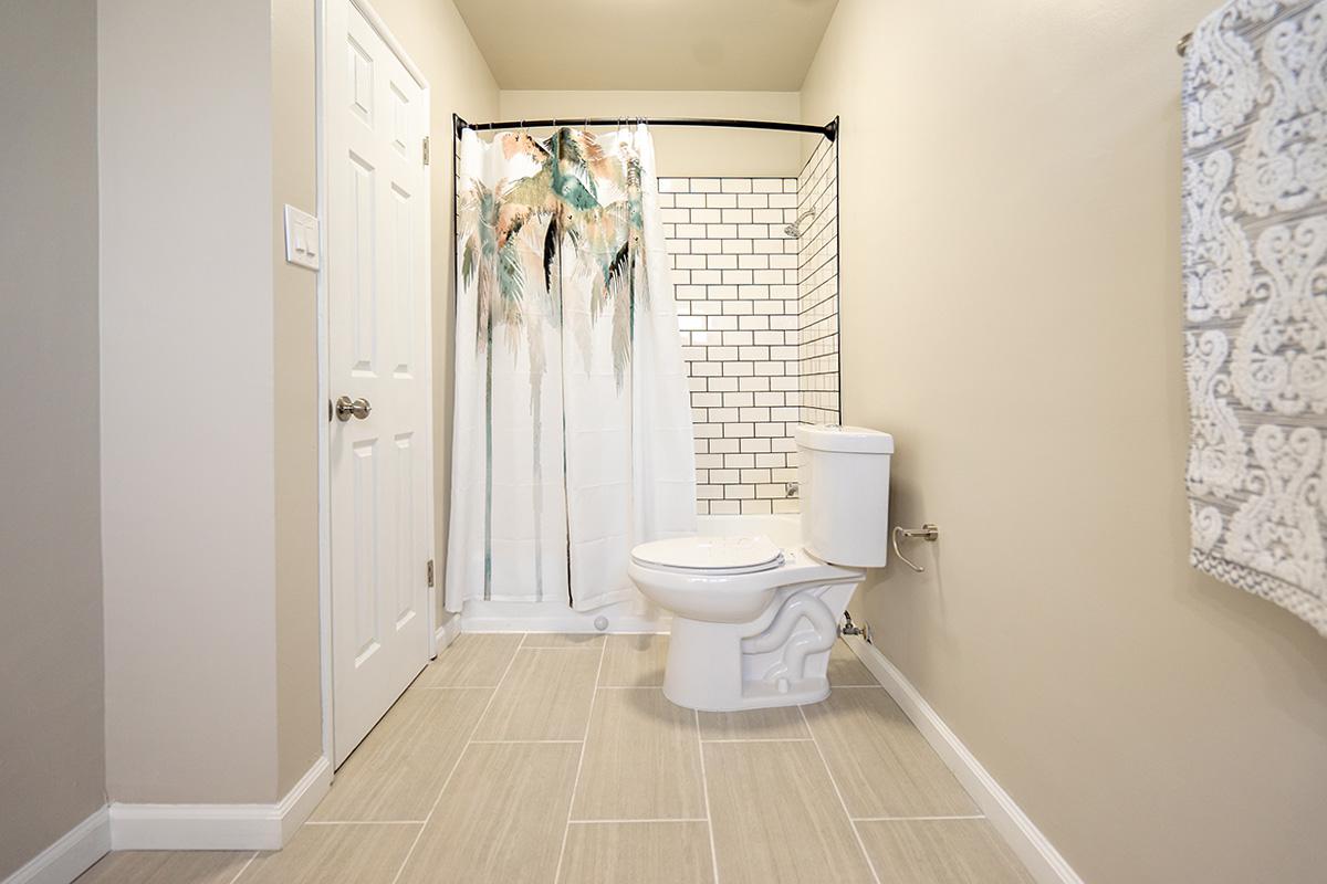 a white tub sitting next to a door