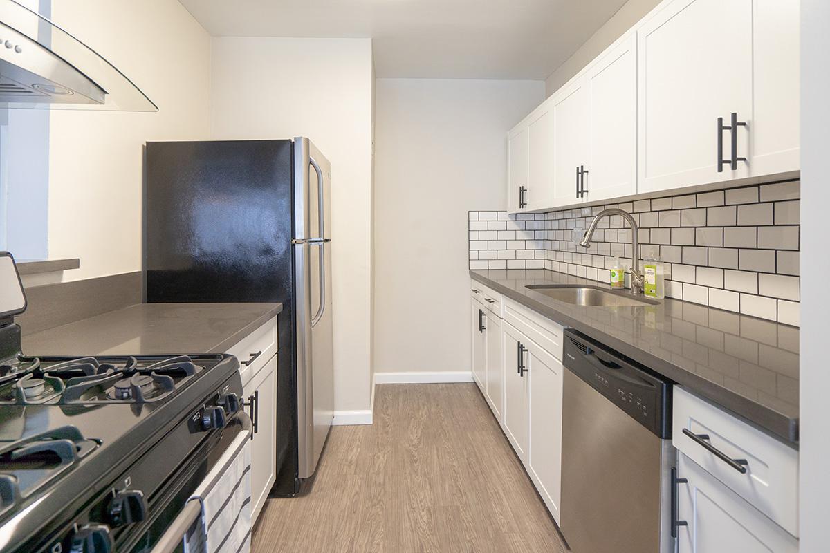 a kitchen with a stove top oven