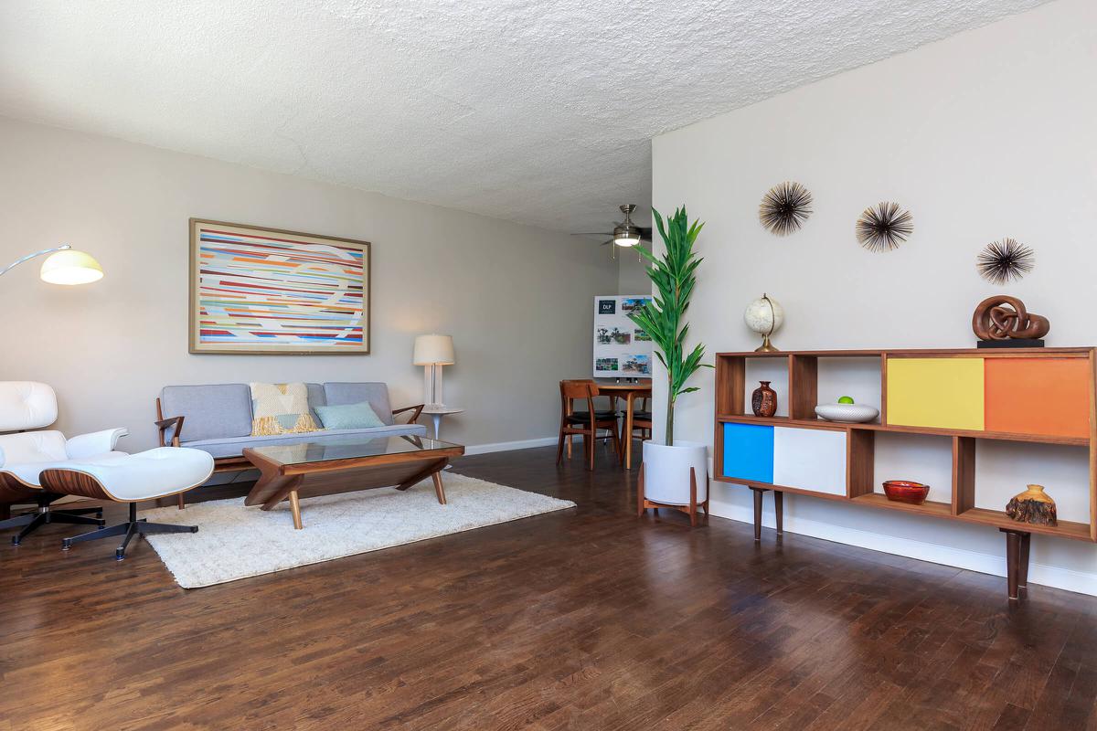 a living room with a wood floor