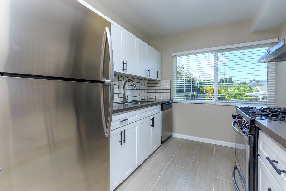 a large kitchen with stainless steel appliances