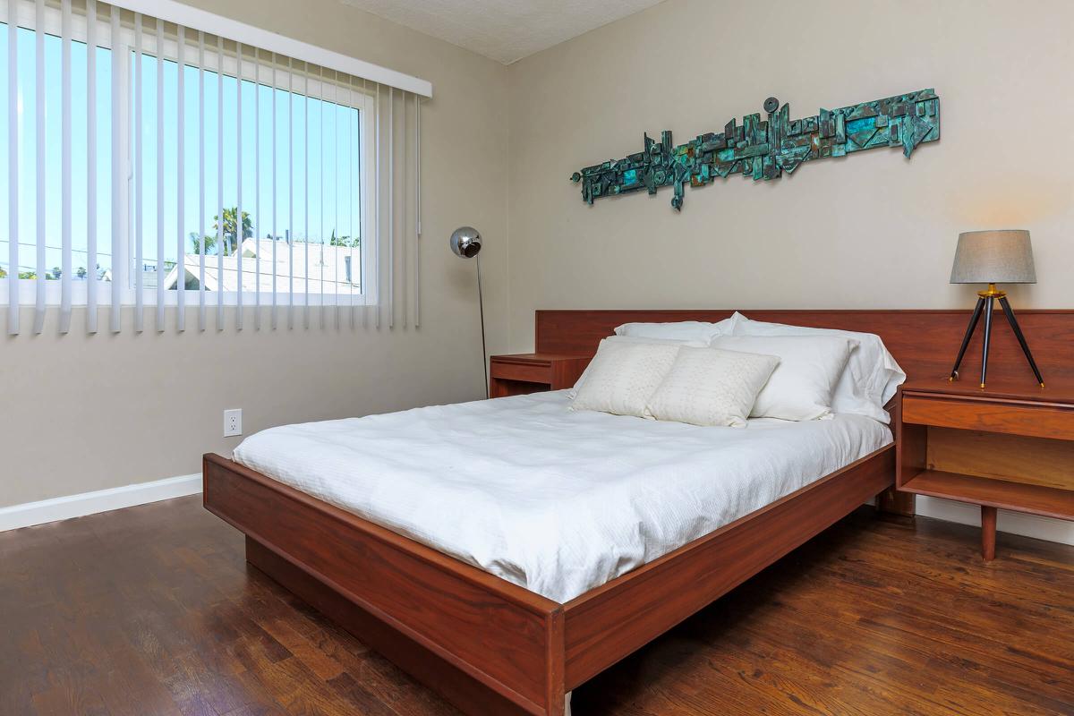 a bedroom with a bed in a room