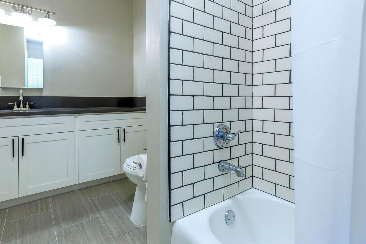 a white sink and a mirror
