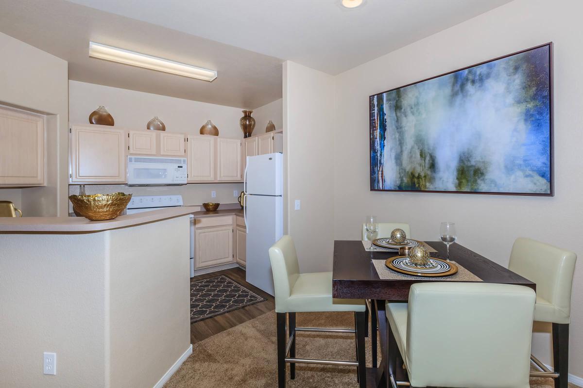 a living room filled with furniture and a refrigerator