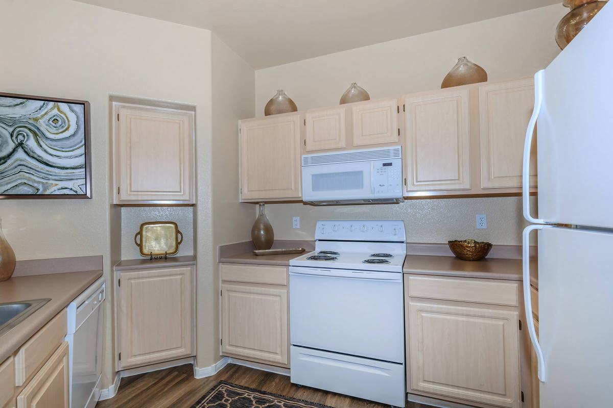 a kitchen with a sink and a refrigerator