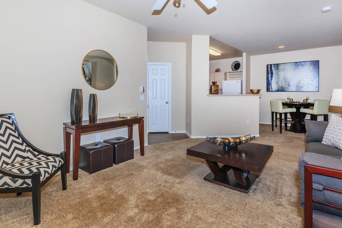 a living room filled with furniture and a table