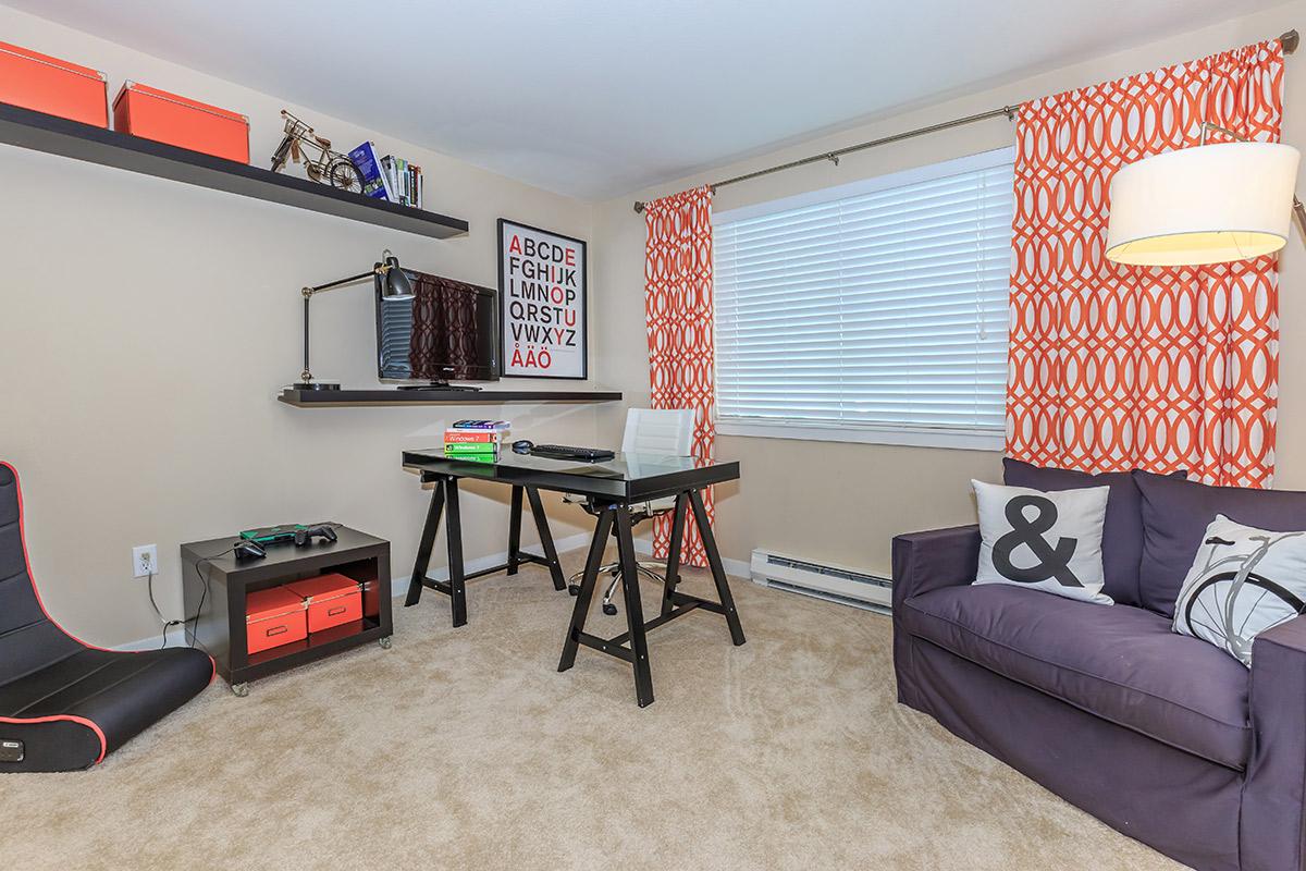 a living room with red floor