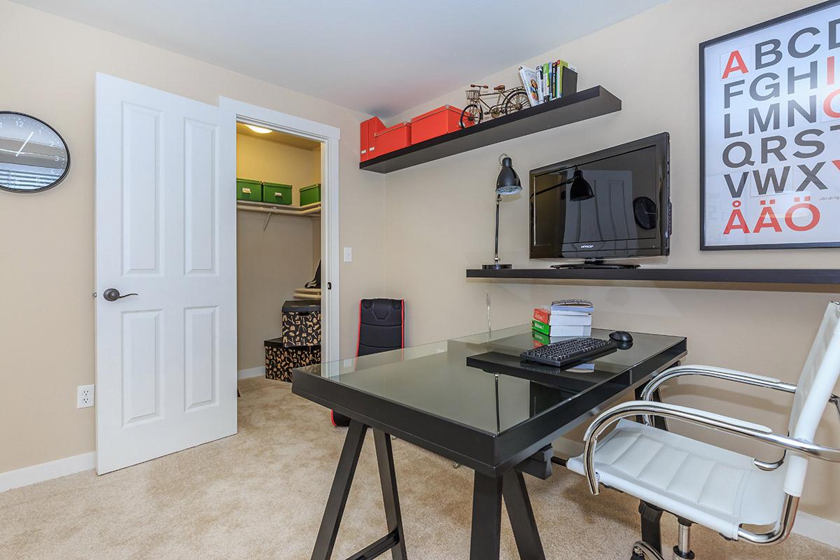 a room with a desk and chair
