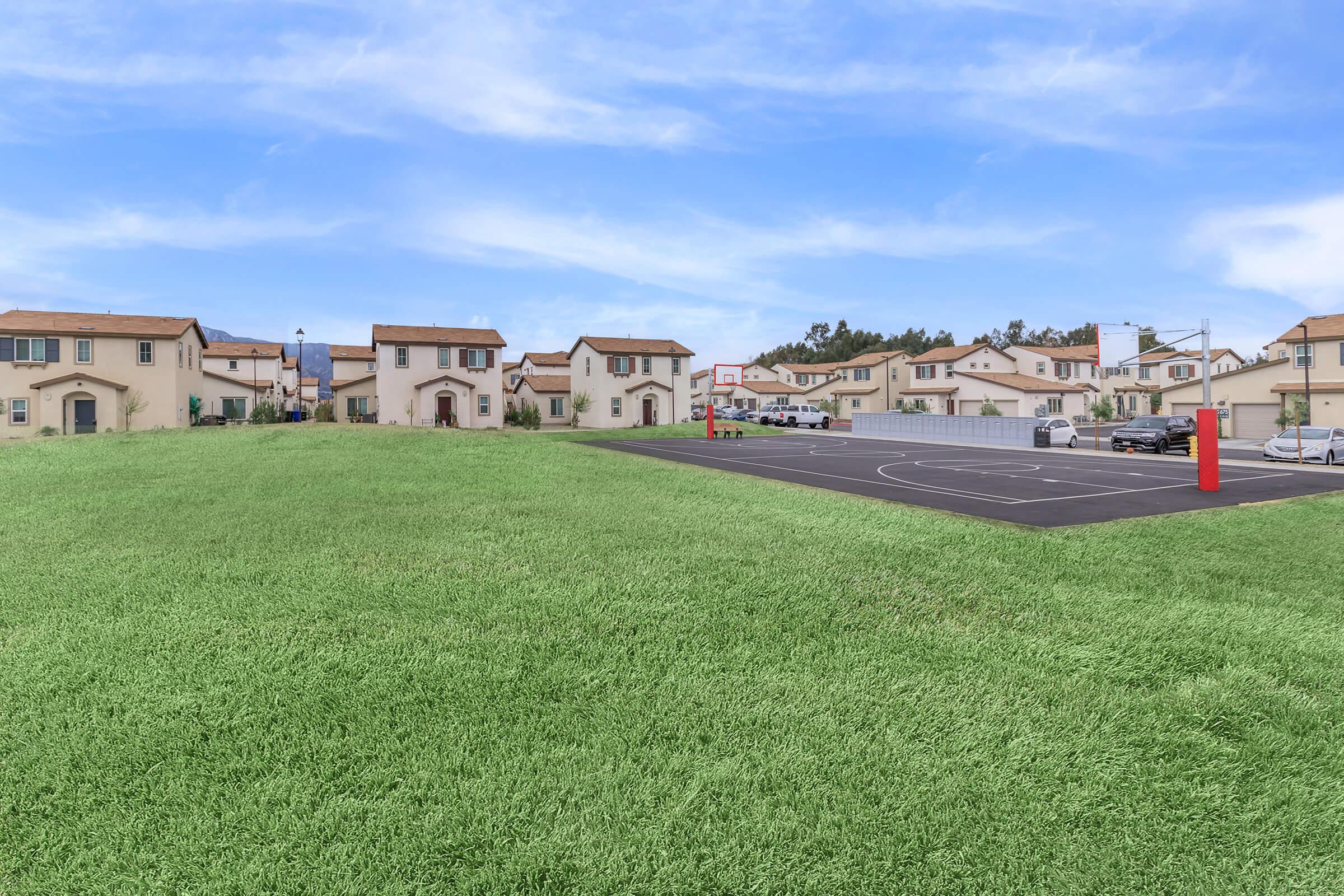 Cottages at Mission Trail basketball court and green field