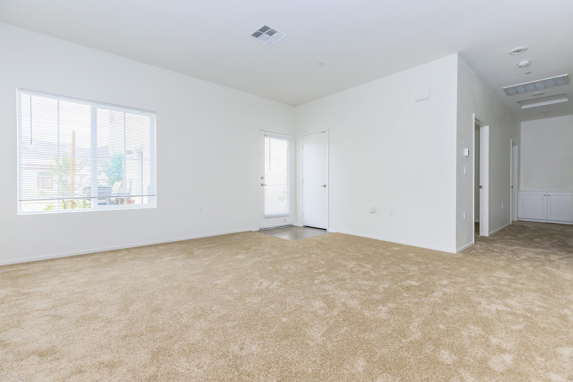 Living room and hallway with carpet