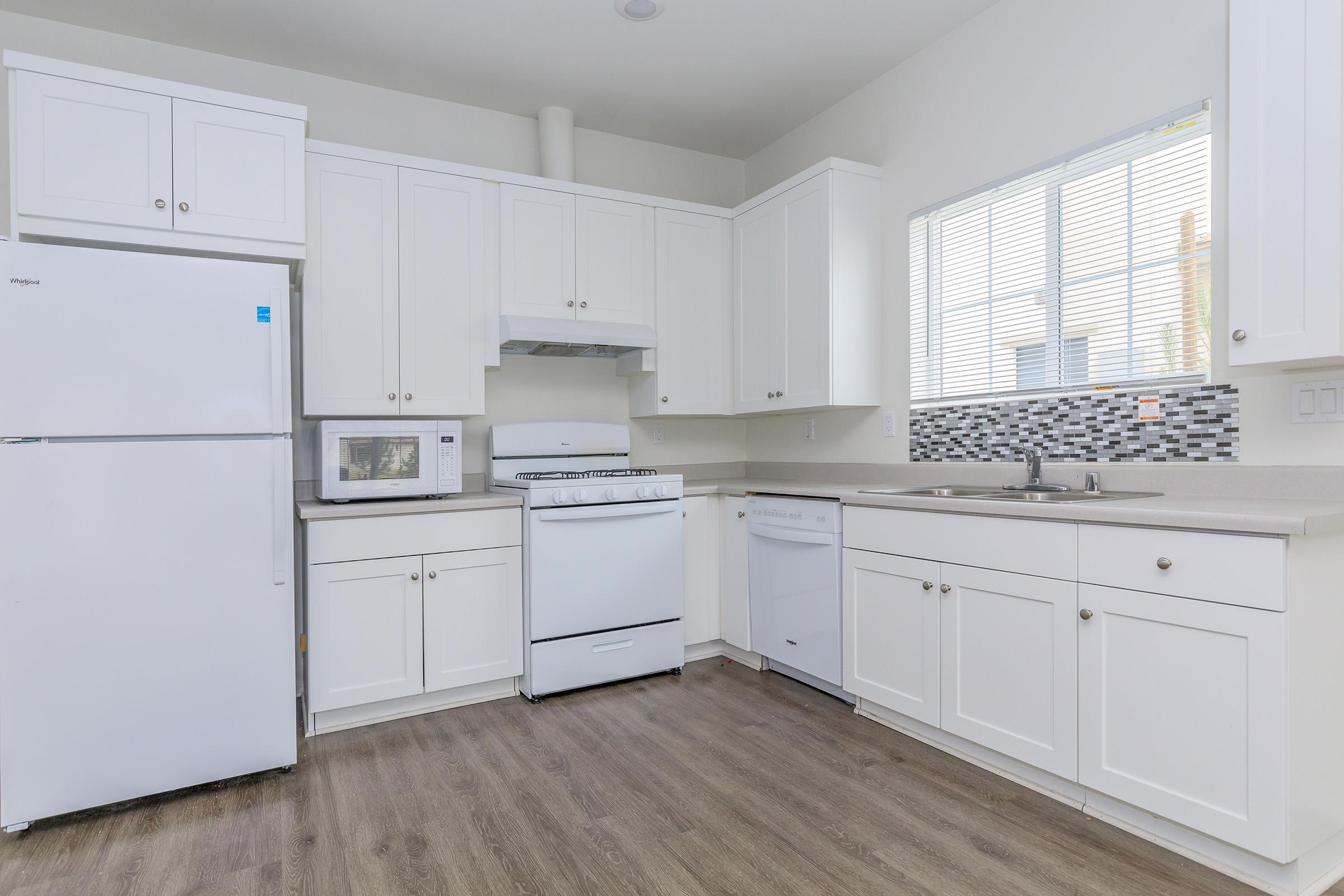 Kitchen with black and white back splash