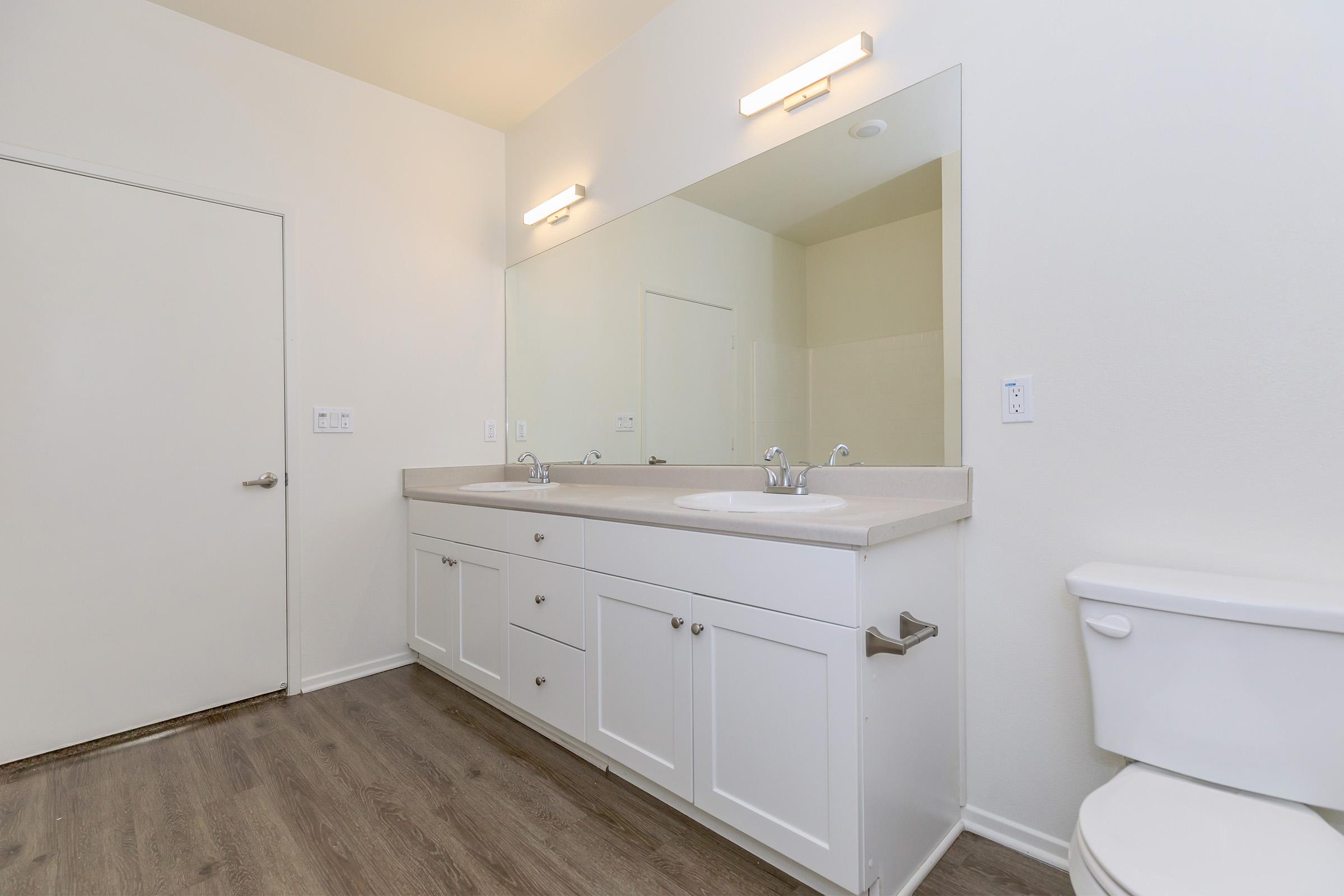 Bathroom with white cabinets