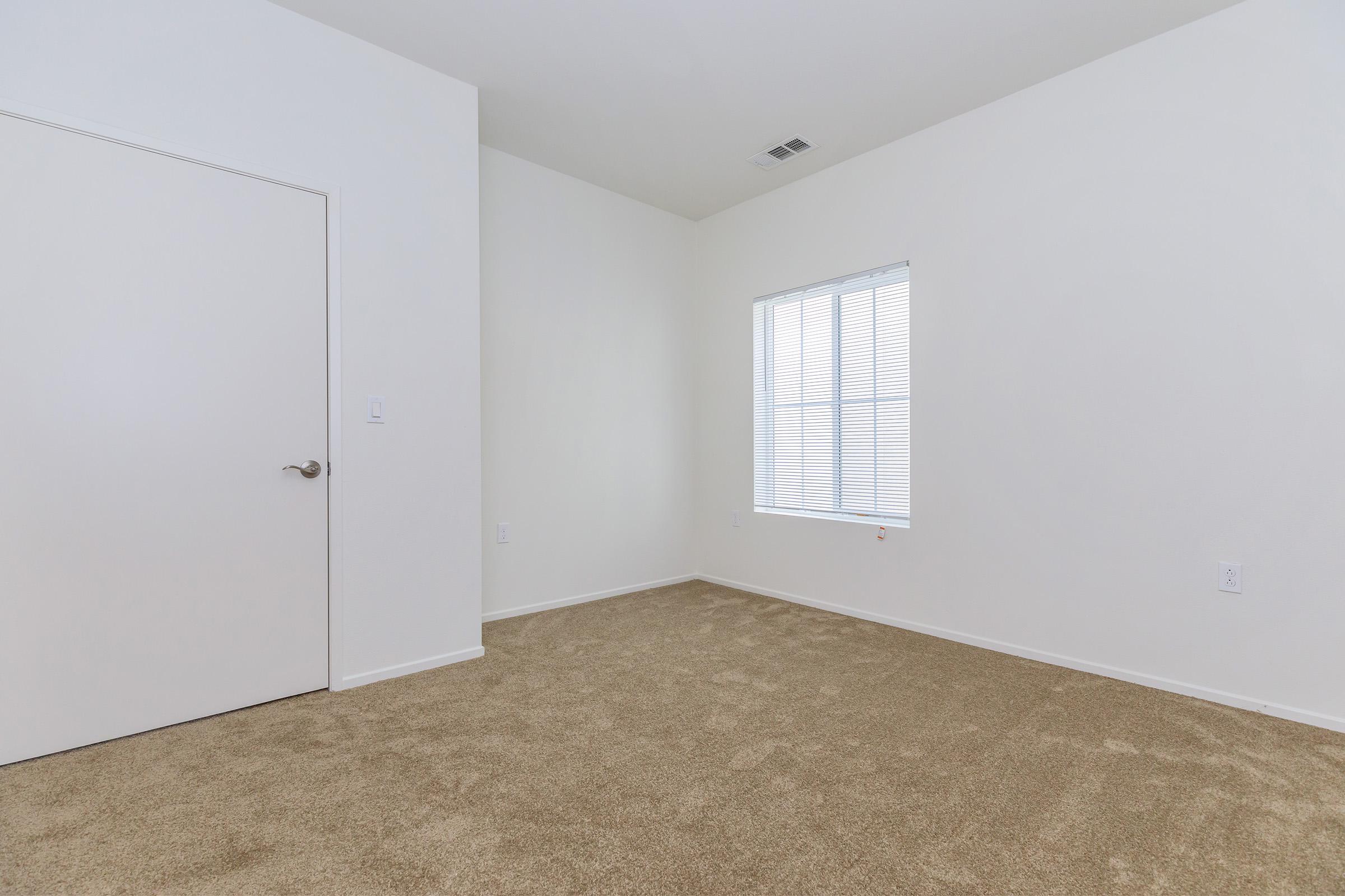 Vacant bedroom with a closed door