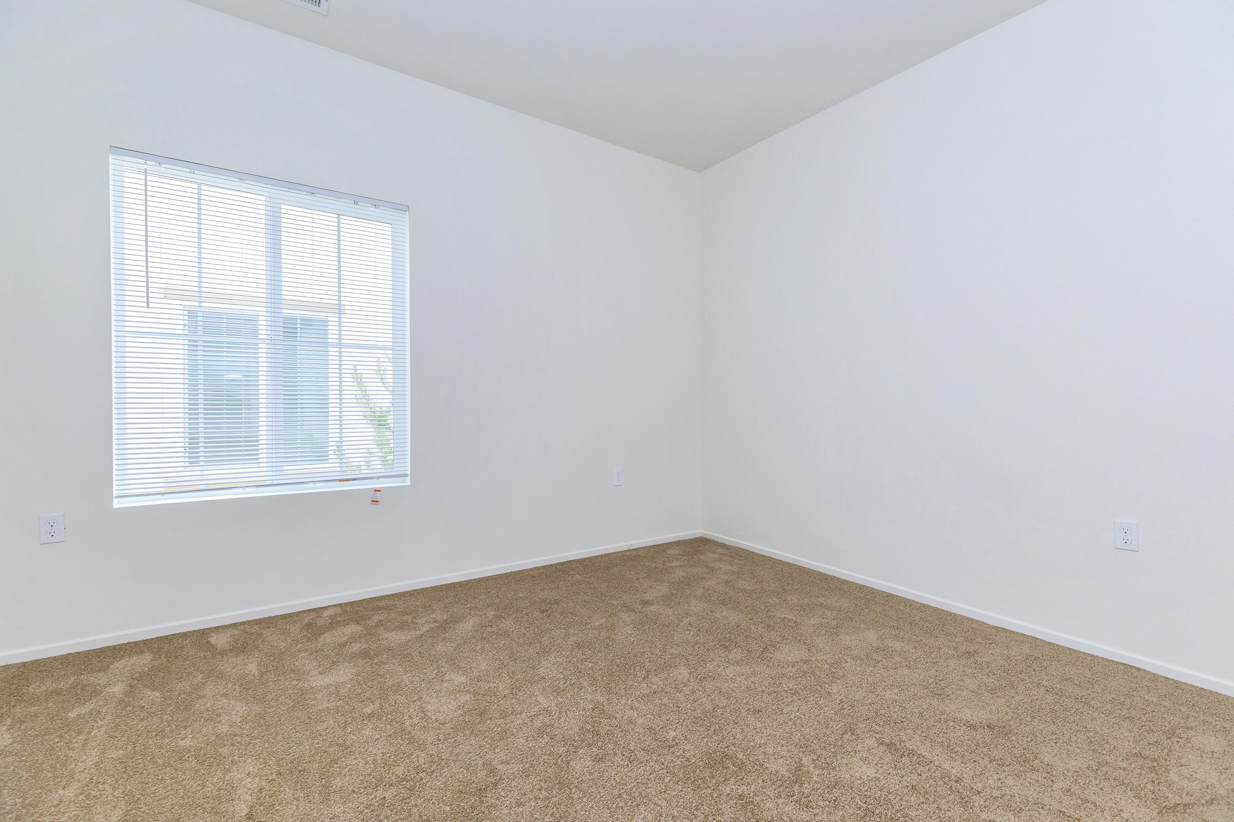 Cottages at Mission Trail bedroom with carpet