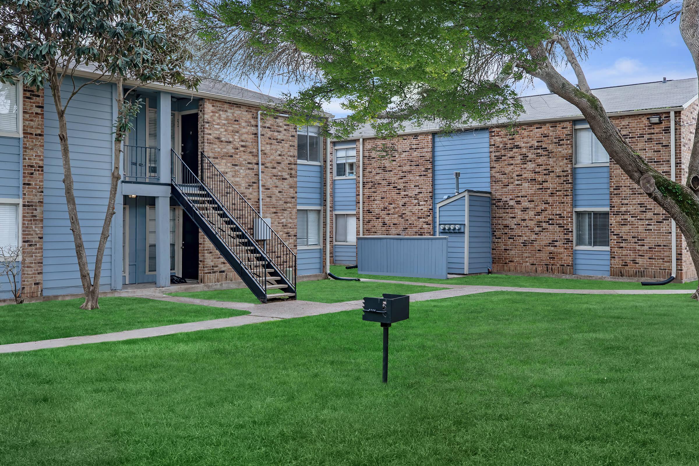 a large lawn in front of a house