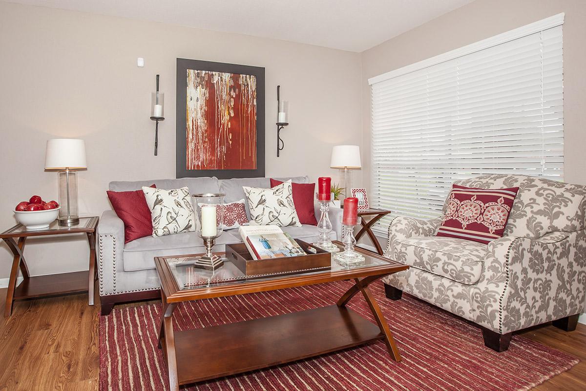 a large red chair in the living room