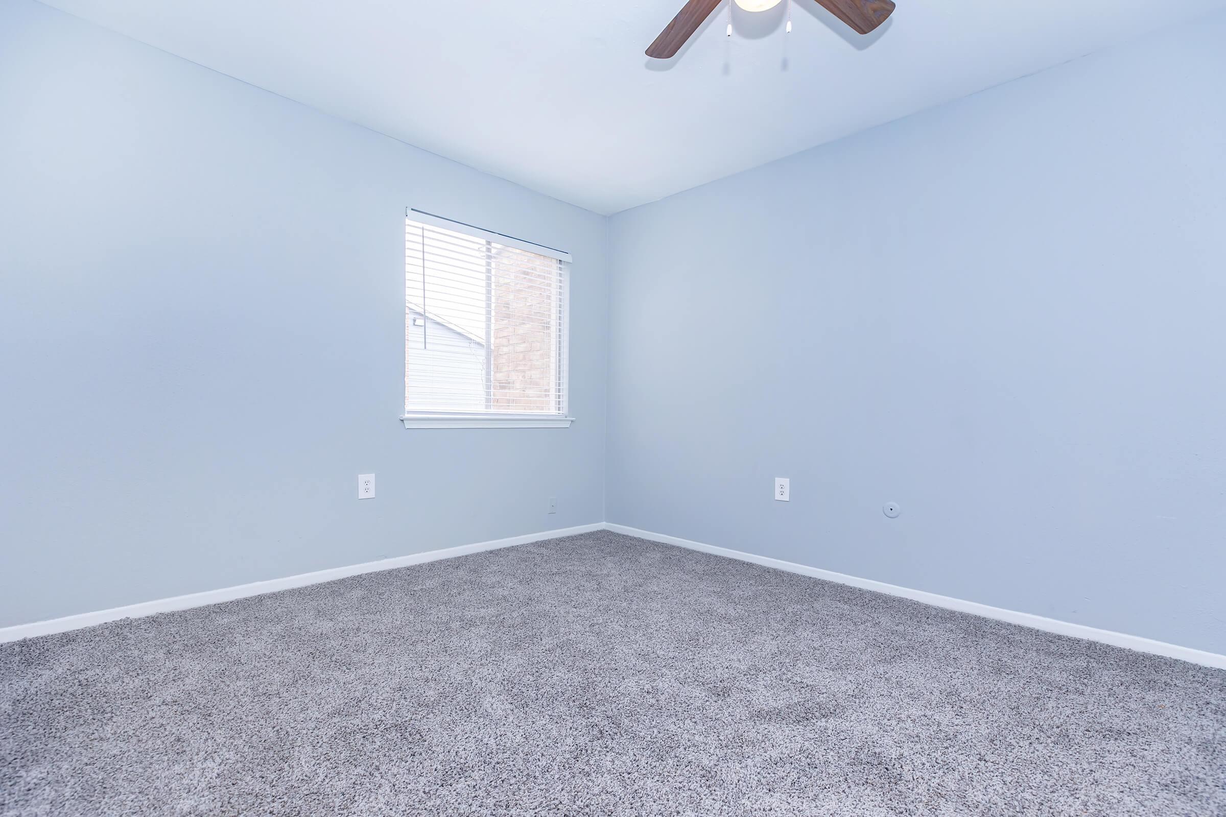 a bedroom with a large window