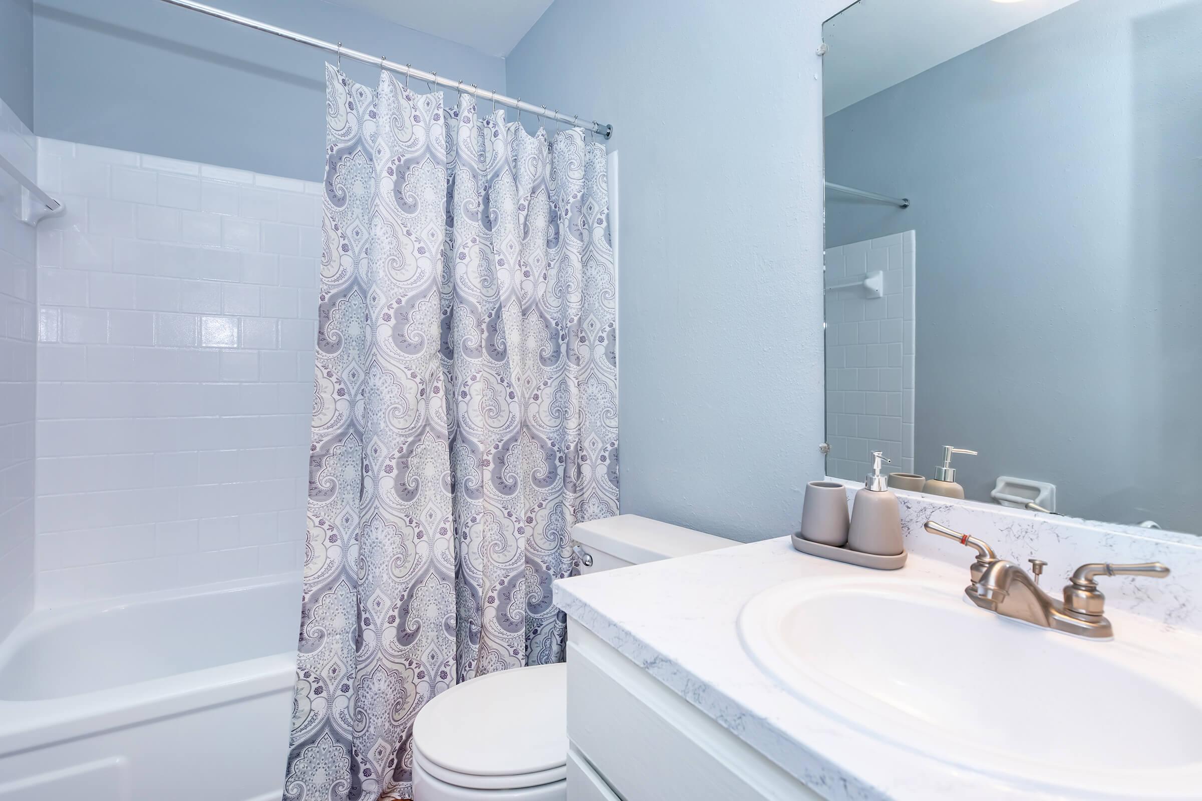 a room with a sink and a bath tub