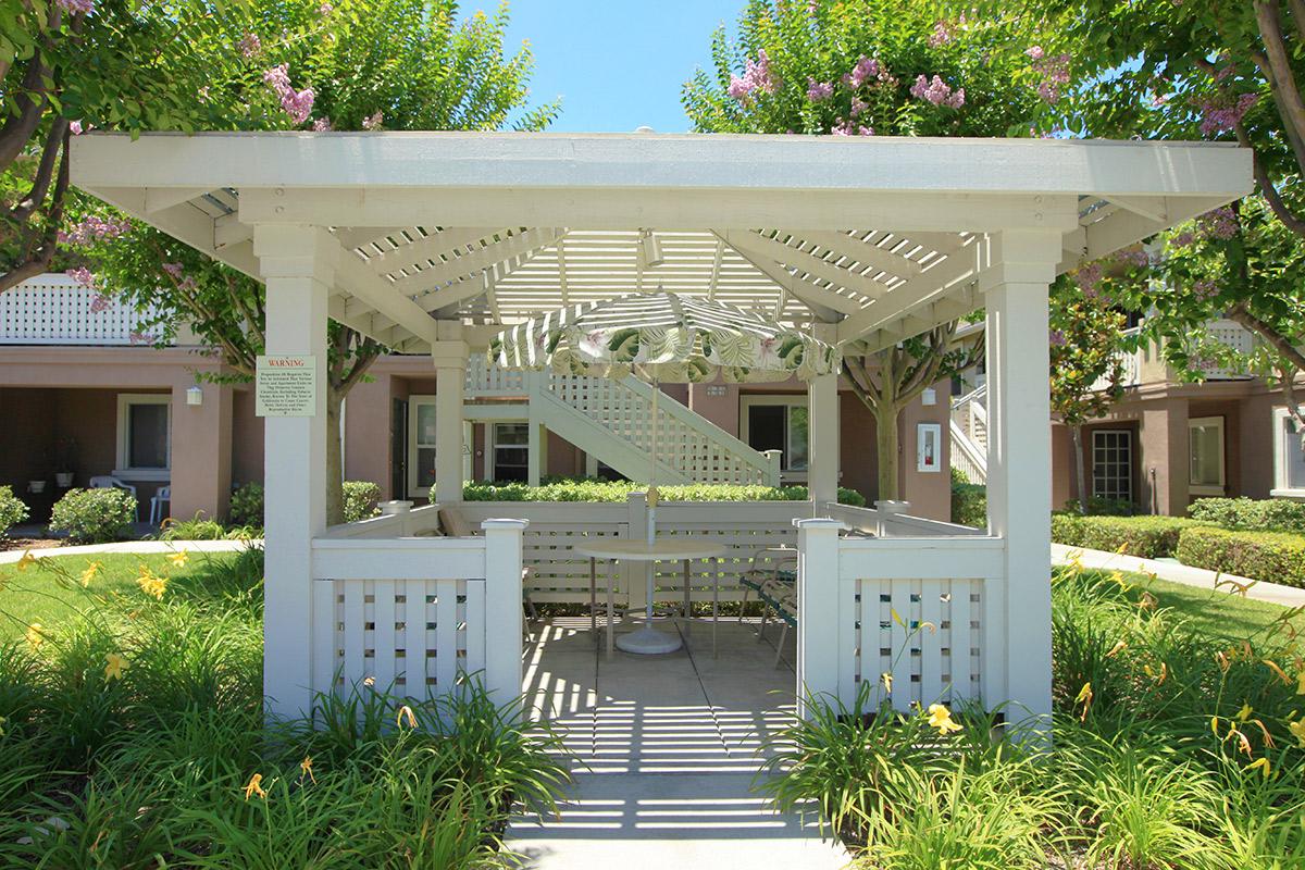 Community gazebo with a table and chairs