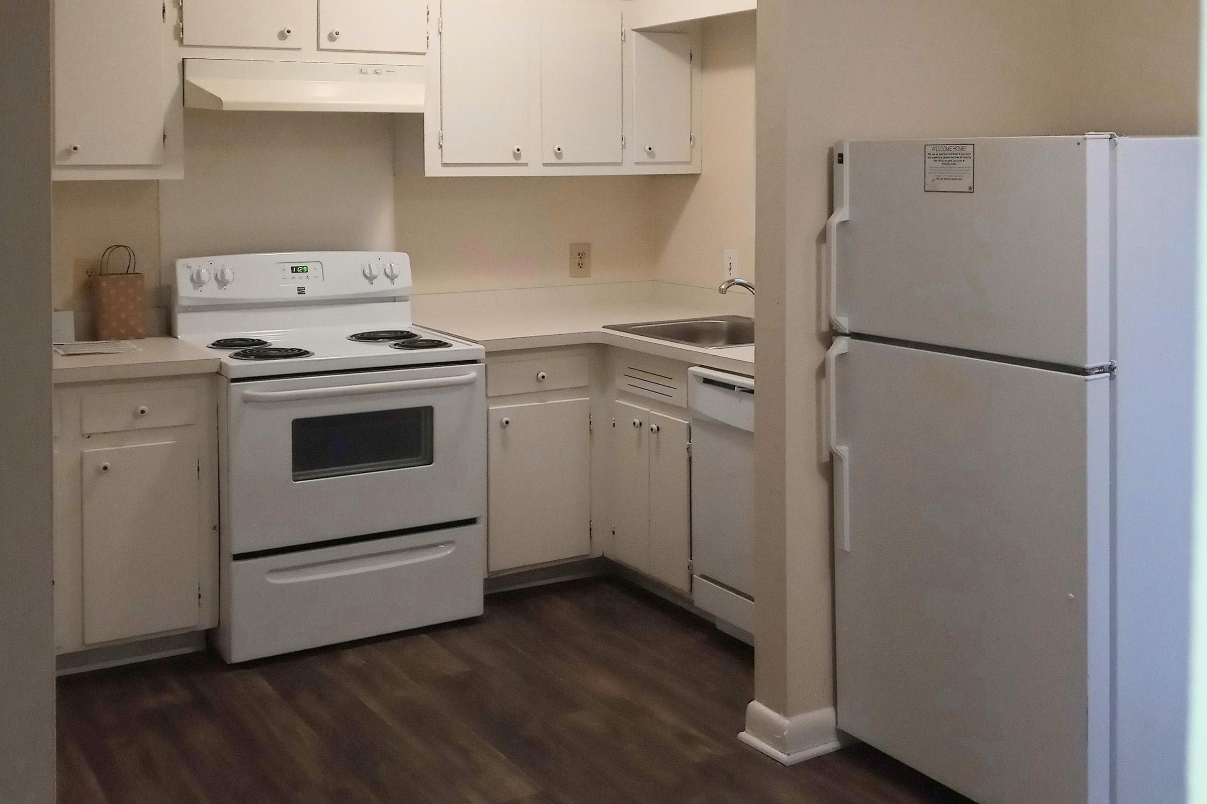 a kitchen with a stove top oven sitting inside of a refrigerator