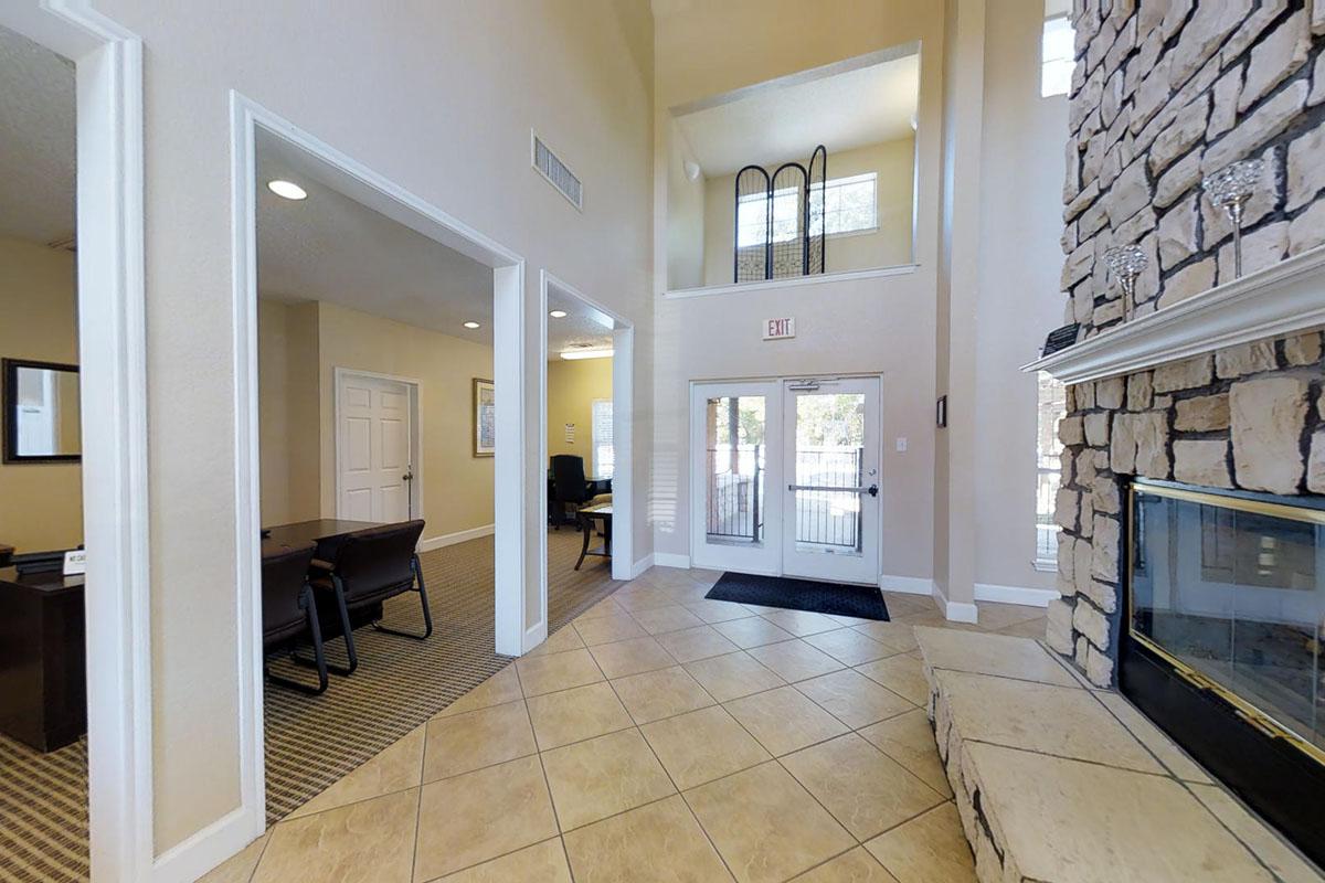 a room filled with furniture and a large window