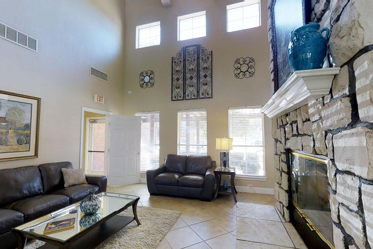 a living room filled with furniture and a fireplace