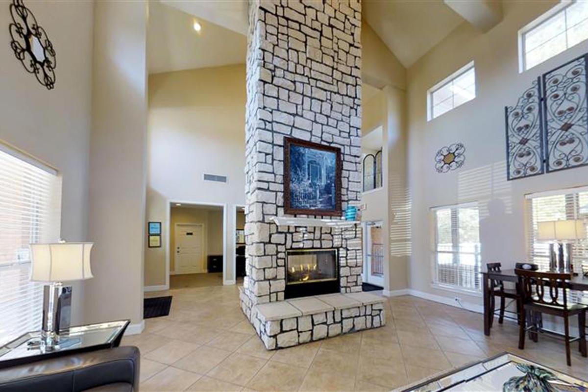 a living room filled with furniture and a fire place