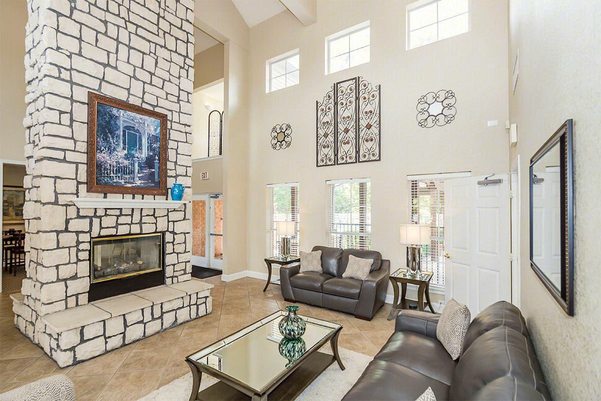 a living room filled with furniture and a fire place