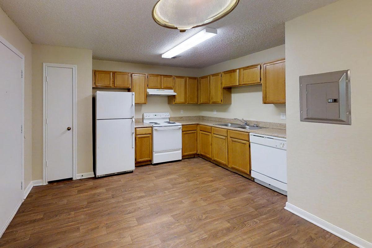 a kitchen with a wood floor