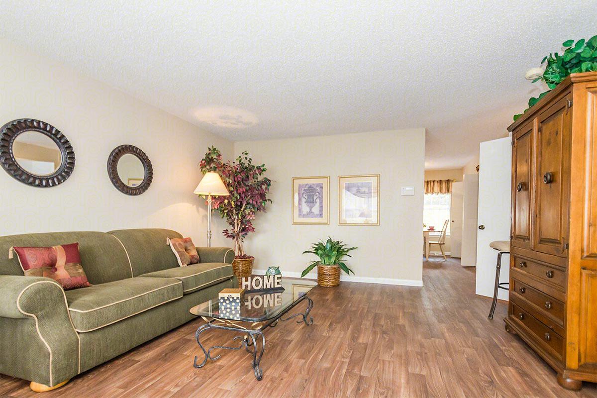 a living room filled with furniture and a tv