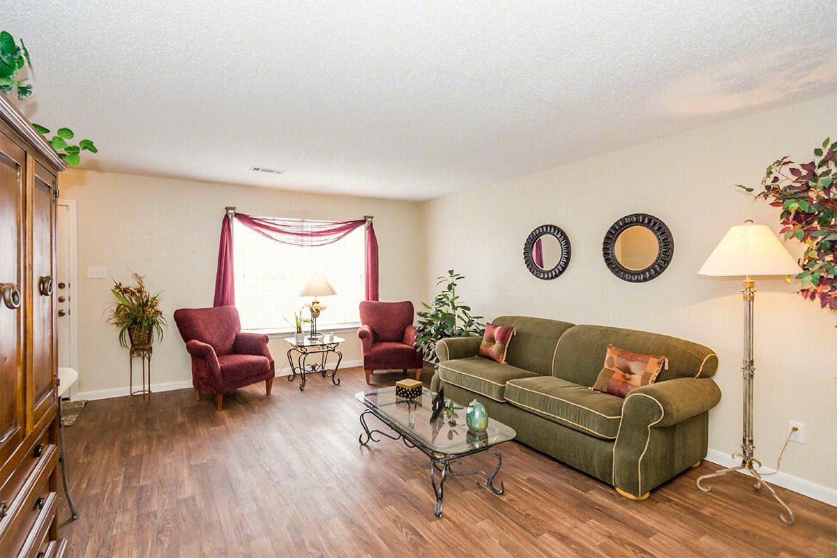 a living room filled with furniture and a fire place