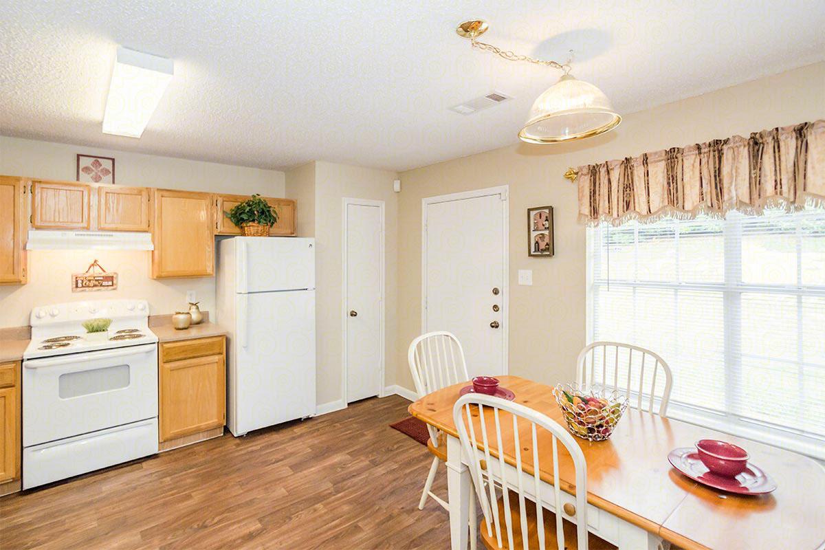 a kitchen with a dining room table