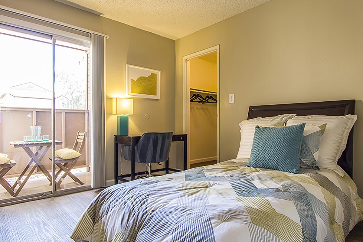 Bedroom with natural light and Balcony - Coral Point Apartments - Mesa - Arizona