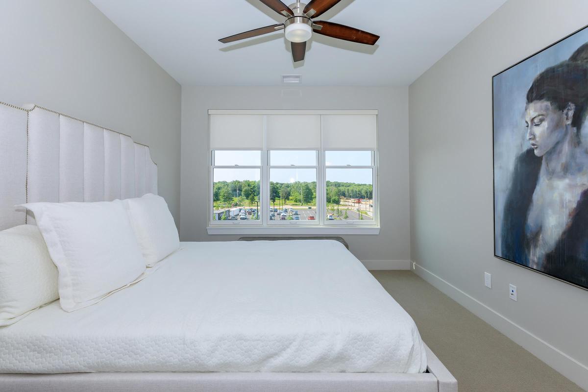 a large white bed in a room