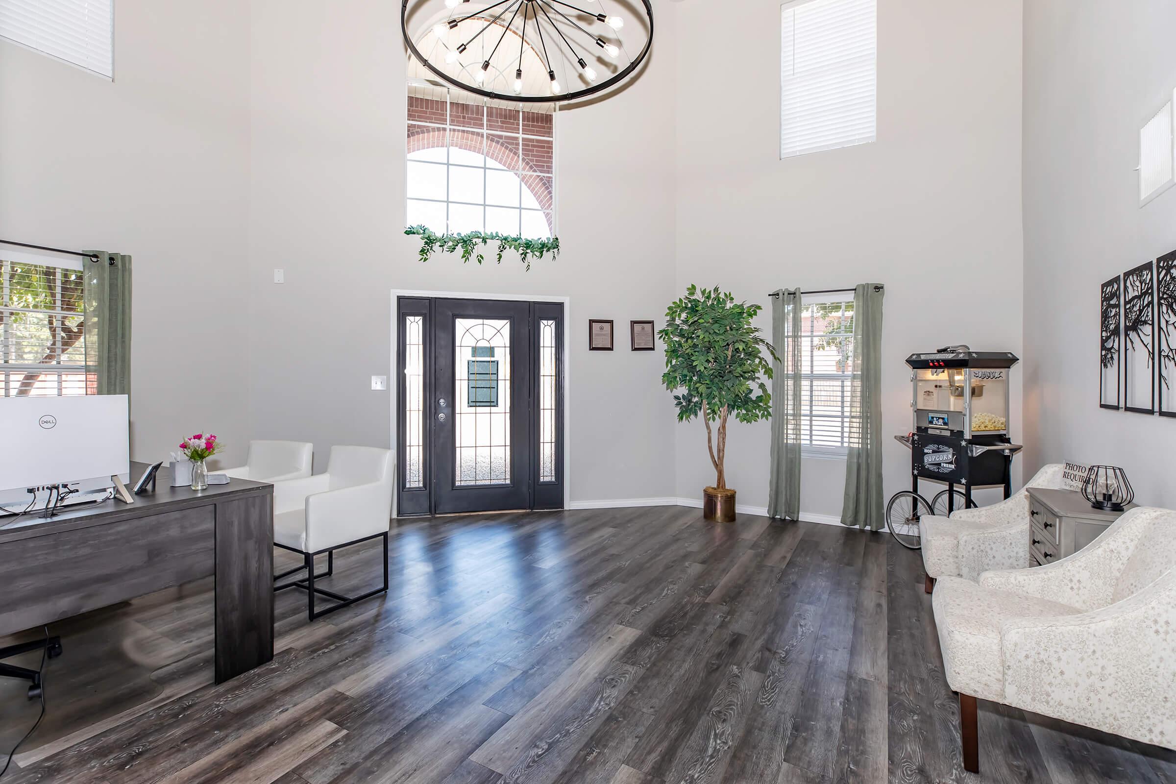 a living room filled with furniture and a clock