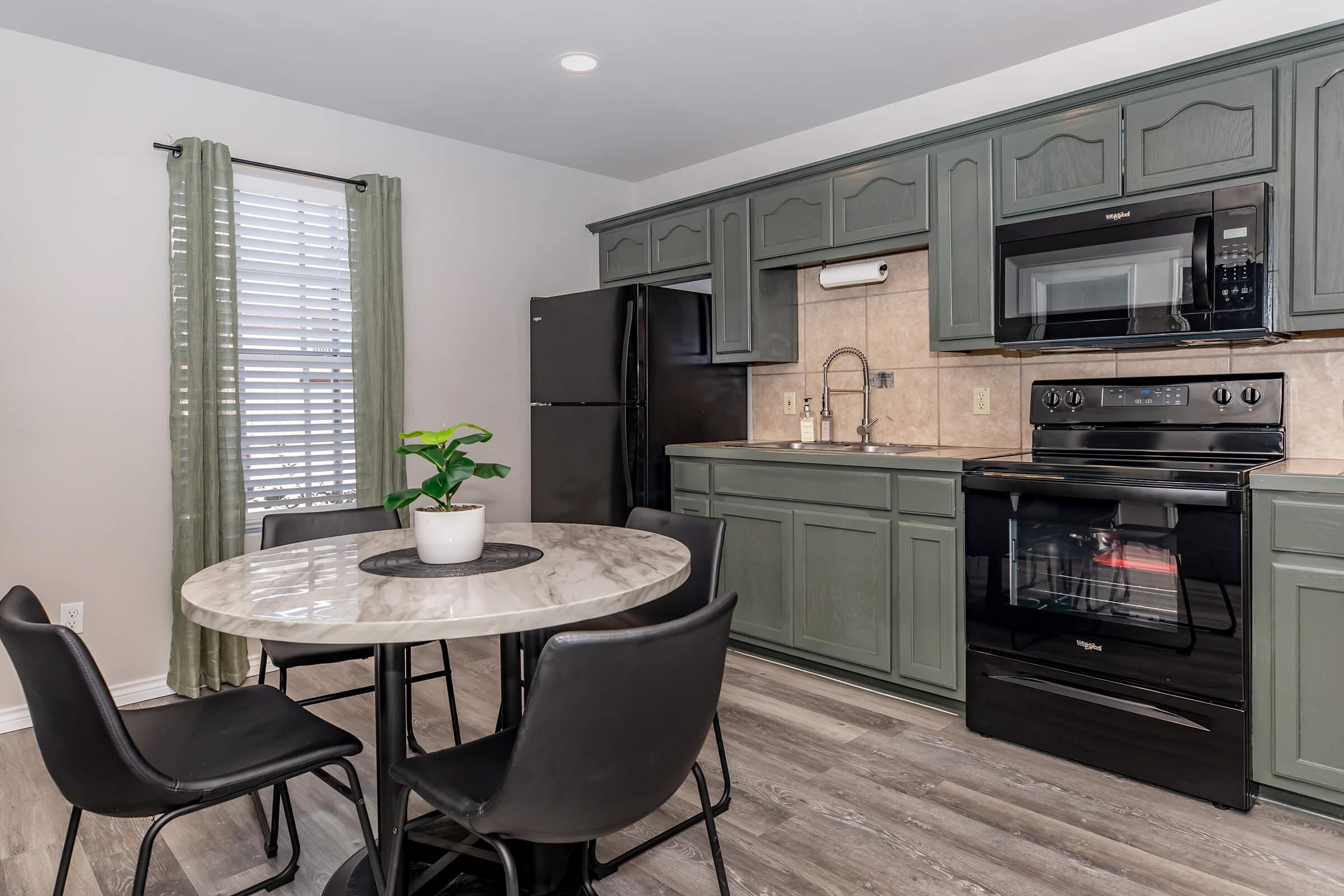 a modern kitchen with stainless steel appliances