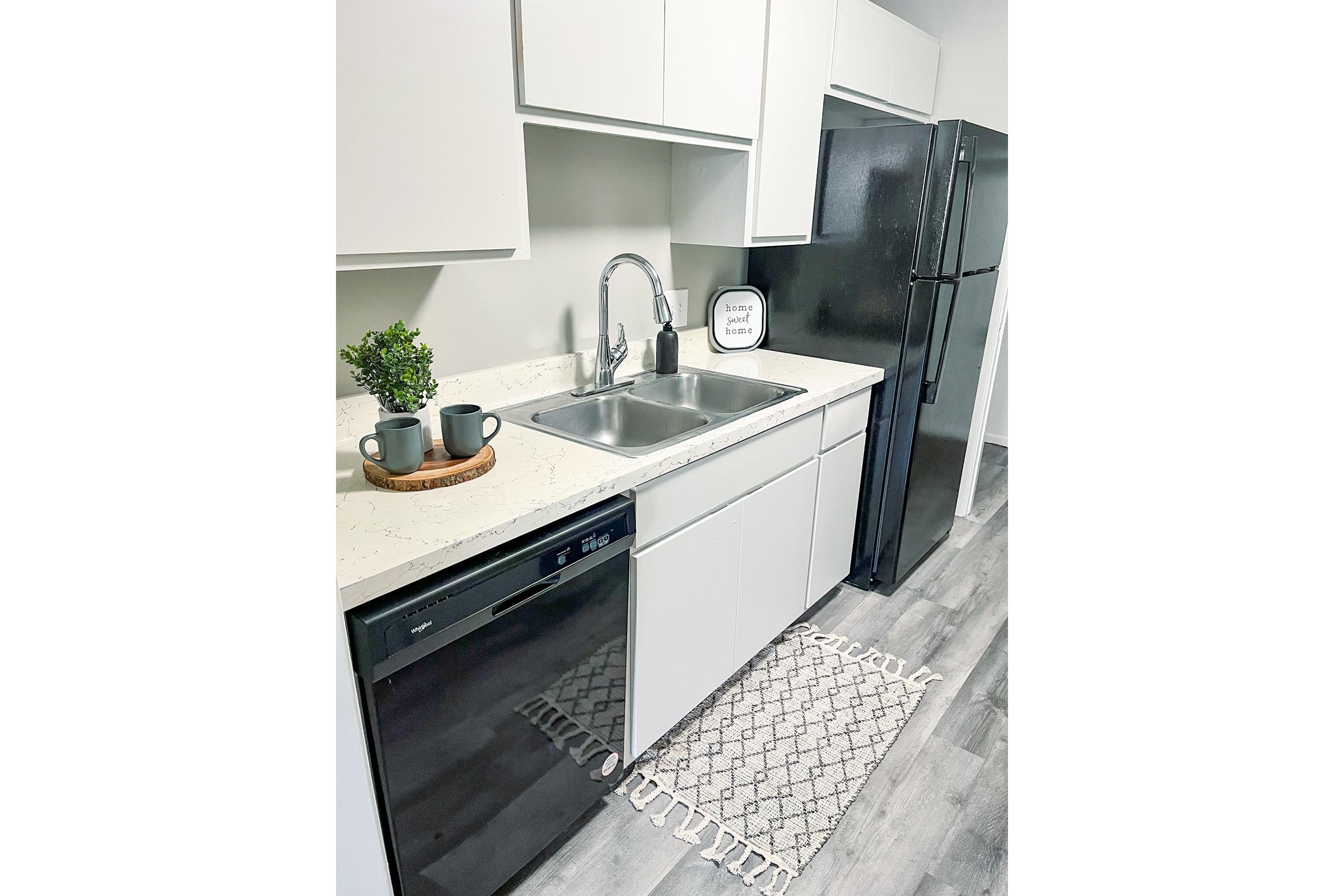 a kitchen with a stove and a sink