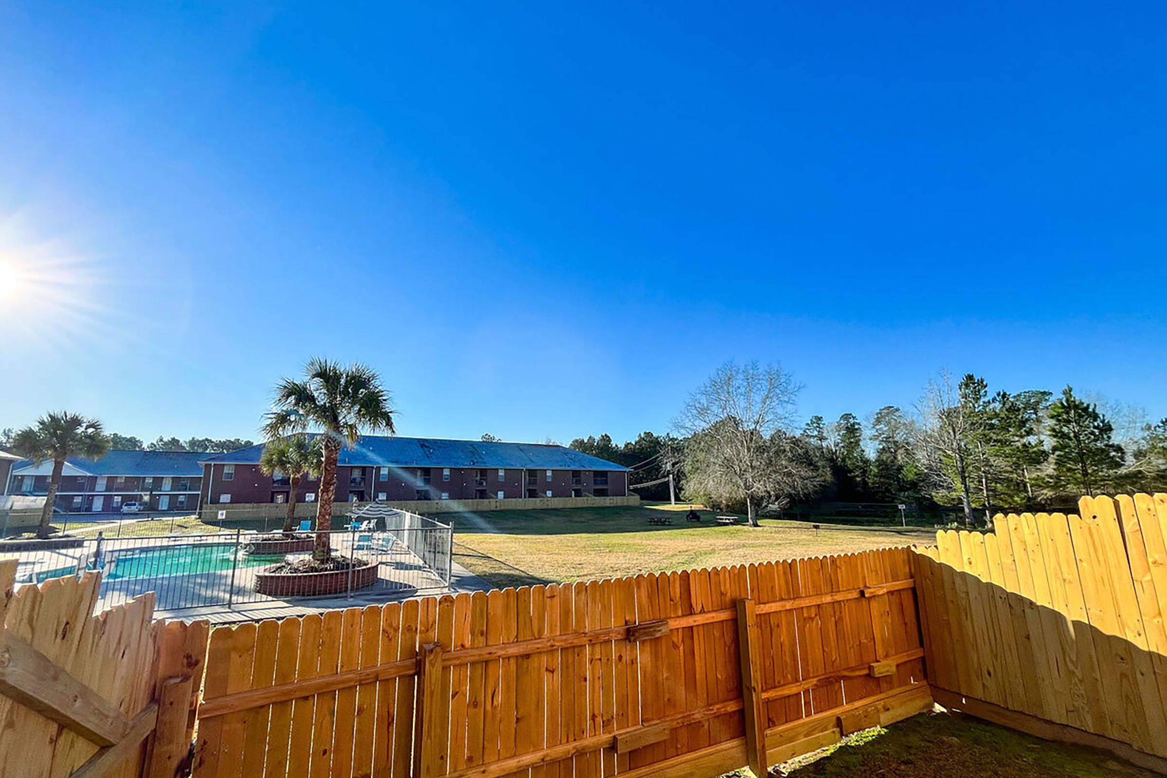 a building with a wooden fence