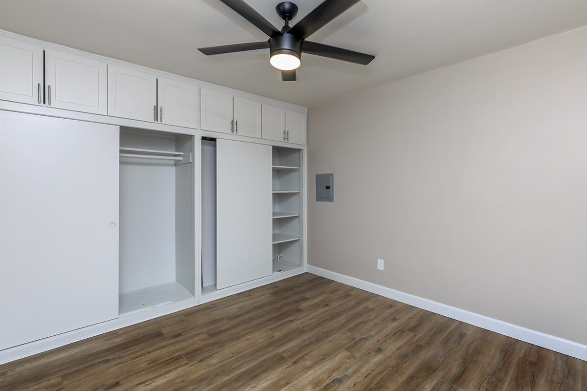 Lots of closet space, a ceiling fan and wood-like flooring  in our bedroom here in one bed one bath C floor plan 
