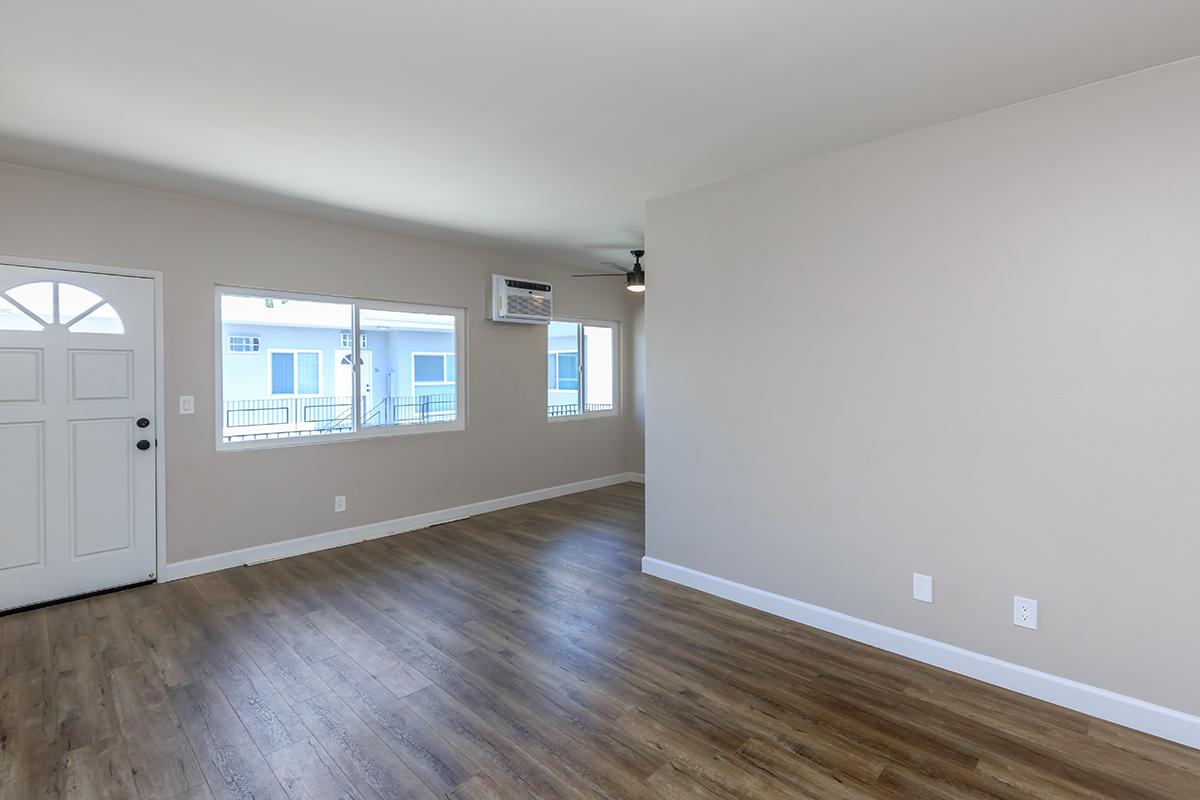 Flats on Elk one bed one bath D with beautiful wood-like flooring lots of windows to let in natural light and a ceiling fan in the dining area.