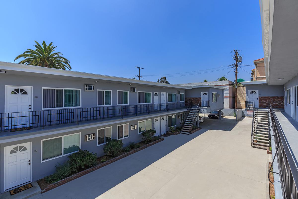 Beautiful apartments in Glendale, CA that have beautiful doorways, windows, and walkways.